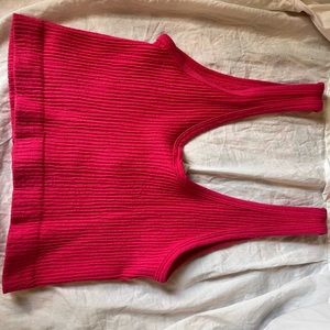 A pink Urban Outfitters crop tank top.